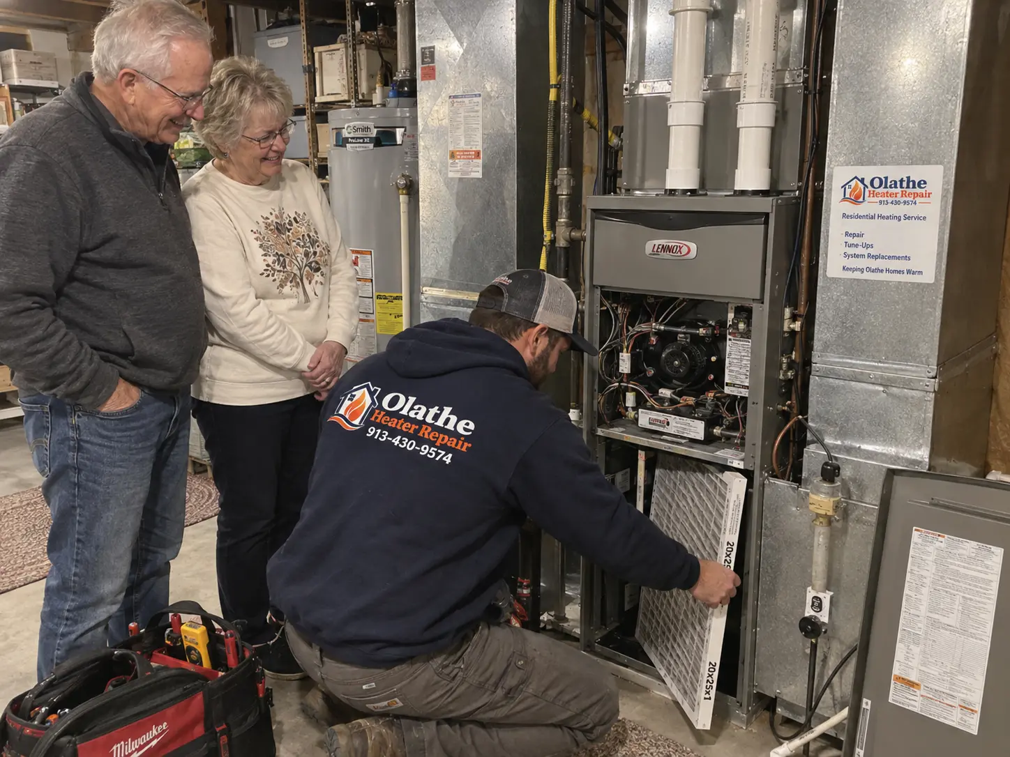 Technician replacing a furnace filter on a Lennox furnace while homeowners look on